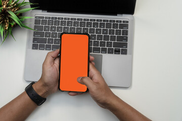 Business people hands working on modern smartphone and laptop. Online Shopping.