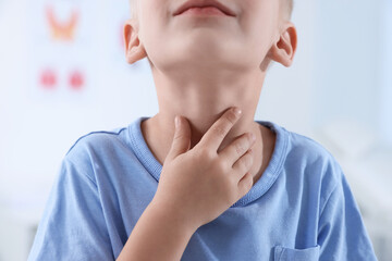 Endocrine system. Little boy doing thyroid self examination indoors, closeup - obrazy, fototapety, plakaty