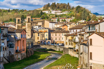 Obraz premium The old town oh Modigliana with the river and the ancient houses. Modigliana, Forlì, Emilia Romagna, Italy, Europe.