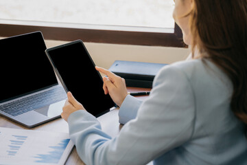 Young woman using laptop computer at home. Business woman working in office. Freelance, lifestyle, web site, technology and online shopping concept.