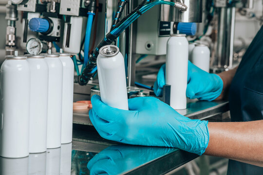 Filling of tin packages for spray with cosmetics in production