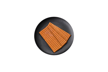 Delicious sweet crispy rectangular waffles on a ceramic plate