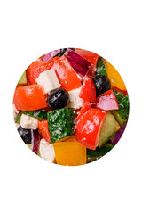 Delicious juicy Greek salad with feta cheese, olives, cucumber and tomatoes