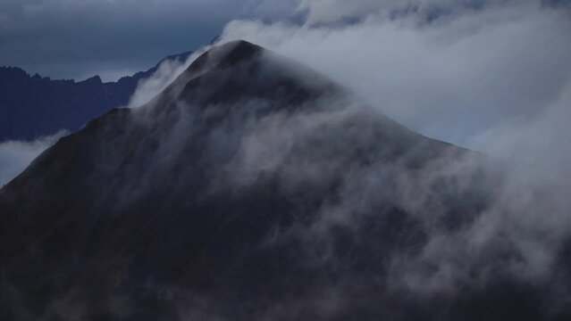 clouds crossing over mountain