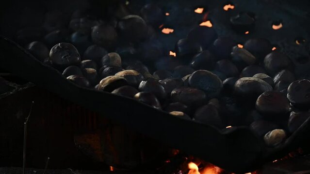 Roasting chestnuts outdoors, prepare healthy and seasonal food
