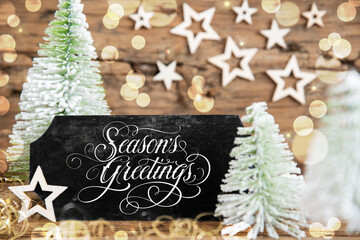 Obraz na płótnie Canvas Christmas Trees, Rustic Holiday Background With Sign With Text Seasons Greetings