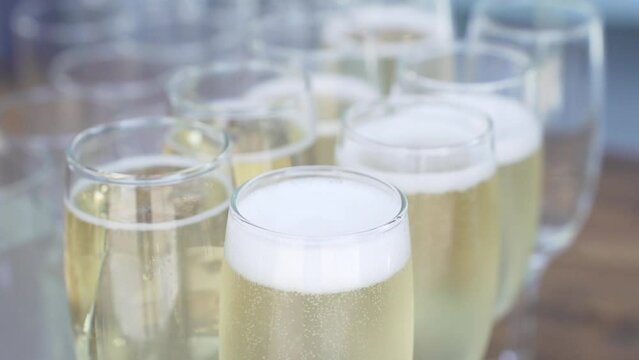 A row of glasses with champagne