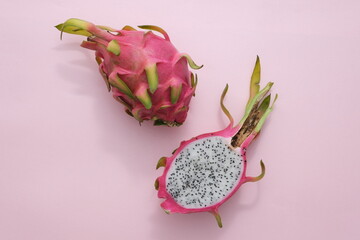 Top view of white dragon fruit displayed on a pastel background. Currently, dragon fruit is grown...