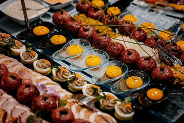 snack of raw egg yolks