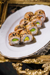 Traditional canada sushi roll on plate