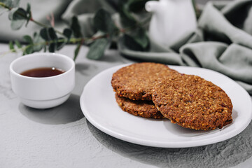 Oatmeal Cookies on White Plate and tea cup