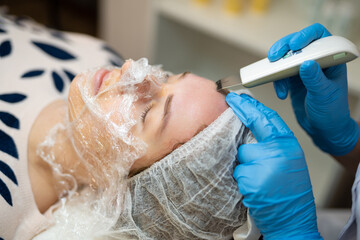 close-up of a girl's face at a cosmetologist during treatment procedures