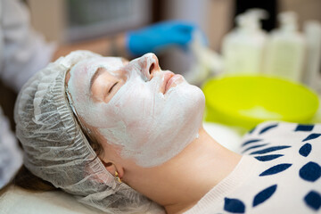 close-up of a girl's face at a cosmetologist during treatment procedures