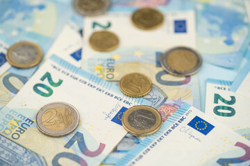 many 20 euro bills and various euro coins