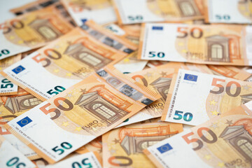 many 50 euro bills close-up mixed haphazardly