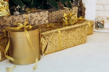 Cozy flat apartment photo studio room green Christmas Tree gifts presents garlands, candles decorated toys balls interior New Year lights glowing bokeh

