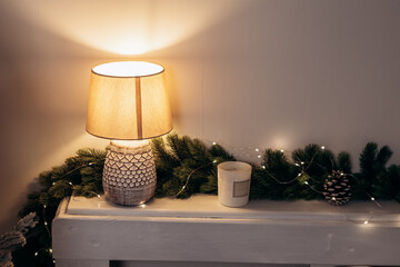 Cozy flat apartment photo studio room desk lamp with warm light green Christmas Tree gifts presents...