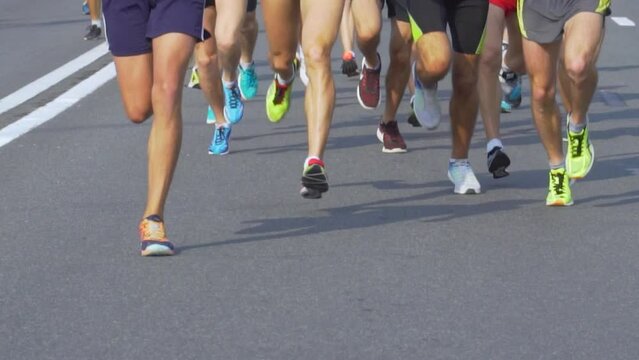 Urban Half Marathon in Minsk, Belarus. Runners Legs Close Up. Slow Motion