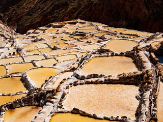 Colorful salt ponds of Maras in the sacred valley of Incas, Cusco region, Peru - 670990048