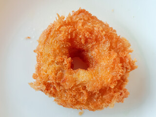 The photo of crispy fried shrimp donuts, each bite-sized morsel perfectly golden and tantalizing, evokes a sense of culinary pleasure and an irresistible desire for these delectable treats.