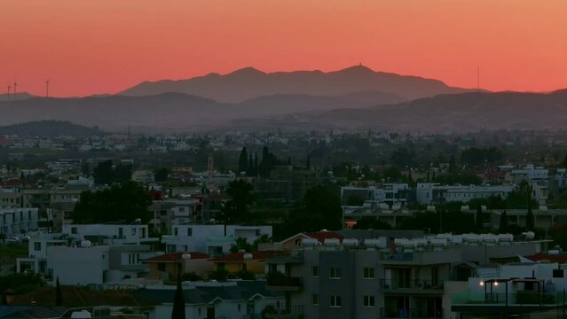 Aerial view sunset cityscape mountains Cyprus. High quality 4k footage