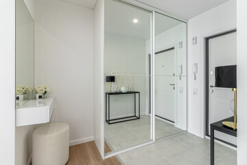 Minimalist hallway with modern interior design in contemporary apartment.