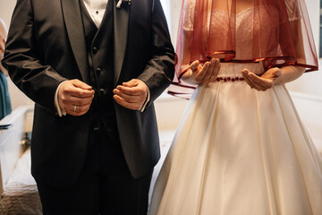 bride and groom holding hands