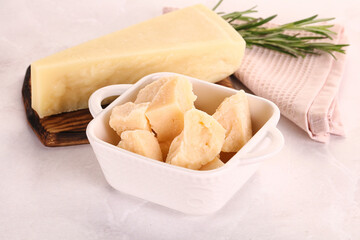 Chopped Italian hard parmesan cheese