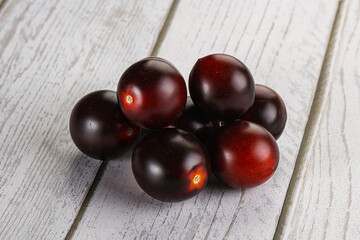 Raw ripe black kumato tomato