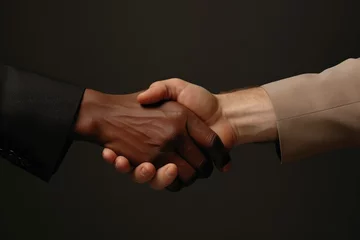 Foto op Canvas Close-up of Diverse hands in suits reach out, symbolising unity and respect in a corporate context, against a neutral background with clean lighting © EVGENIA