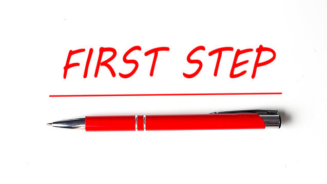 Text FIRST STEP with ped pen on the white background