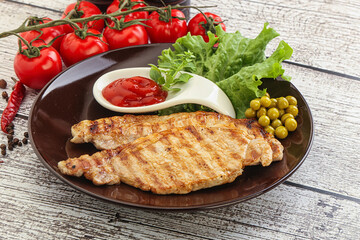 Grilled pork steak with ketchup