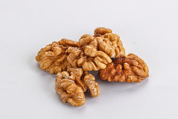 Cracked kernel walnut heap isolated