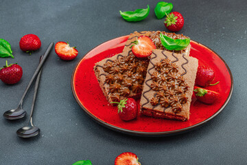 Delicious chocolate cakes with fresh strawberries. Sweet dessert, good morning concept