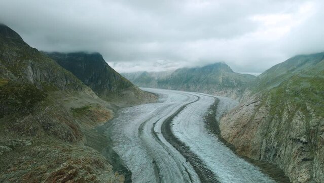 Aerial view of the Aletsch Glacier during cloudy weather in the morning. 