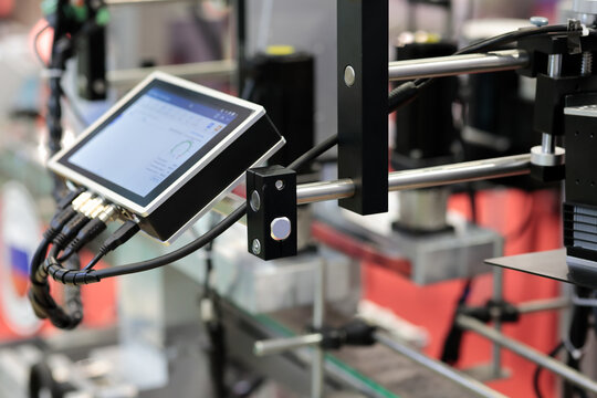 production line with HMI touch screen controller