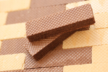 Stacked delicious chocolate wafers in large amount. Two different flavours of classic small waffles