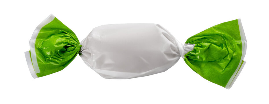 Candy wrapped with green and white paper, close up isolated