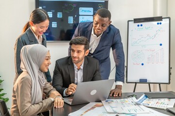 Speaker Motivational multiracial teamwork by explain present data in laptop notebook to colleagues decide. coworker coach explain Analysis Statistics Report laptop presentation to multiethnic teamwork