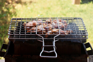 Cooking chicken chops on grill at the sea.Grill, Frying Fresh Chicken Barbecue, Sausage, Kebab,...