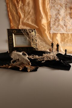 an image of a skull that is on a blanket with candles