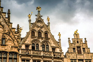 roofs of ancient buildings with gilded figures antwerpen