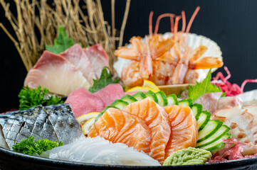 sashimi mixed fresh set japanese food variation in dish. Sashimi Japanese food, Sashimi set with wasabi, fish, shrimp in plate of Assorted. fresh slide mix fish set on ice menu in restaurant