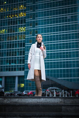 young woman walking in a business center
