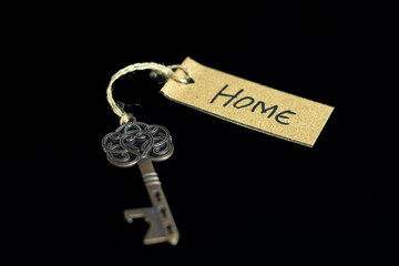 Old decorative key and handwritten tag 