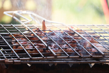 Cooking chicken chops on grill at the sea.Grill, Frying Fresh Chicken Barbecue, Sausage, Kebab,...