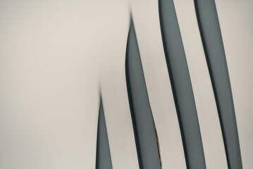 gray abstract background from curved lines of geometric shapes