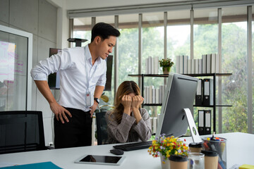 Obraz premium Stressed of female employee and offensive faces that the boss yells, Workplace Conflict, Corporate Communication Problem, stress of business partner discussing, Quarrels, And Bad Attitude At Work