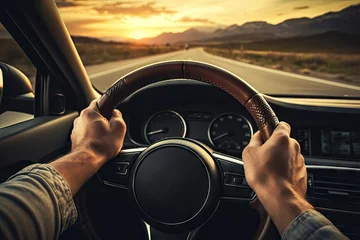 Fotobehang Hands of car driver on steering wheel road trip drive © Tymofii