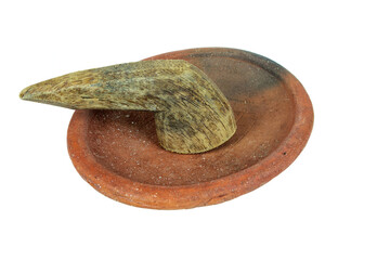 Traditional mortar and pestle made of clay and wood on a white background